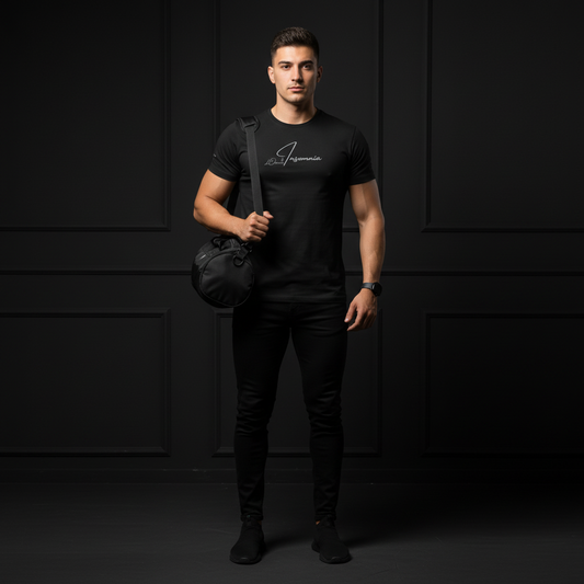 Man wearing a black t-shirt with a logo insomnia, holding a black bag against a dark background