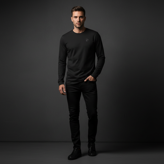 Man wearing a black long-sleeve shirt and pants against a dark background, bold stitch ong sleeve tee