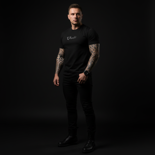 Man wearing a black t-shirt with visible branding against a dark background, core tee