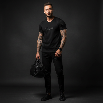 Man holding a black leather bag against a dark background