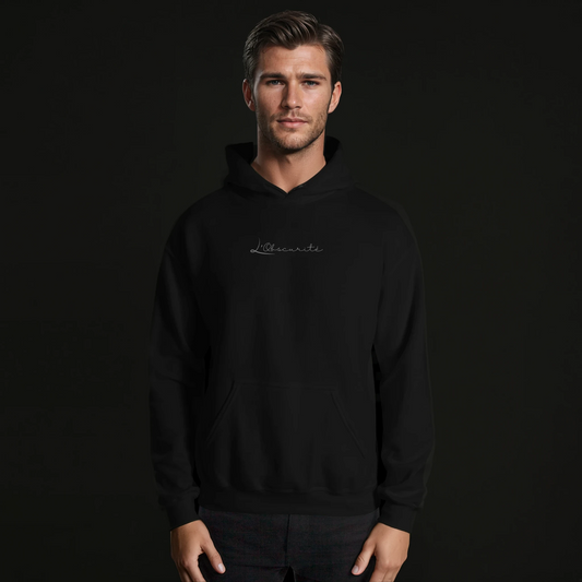 man wearing a black hoodie minimalistic , an essential in your wardrobe 