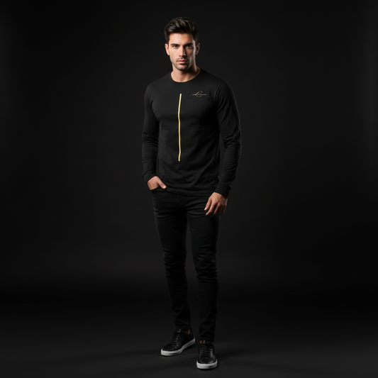 Man wearing a black long-sleeve shirt with a yellow golden line and black pants on a dark background